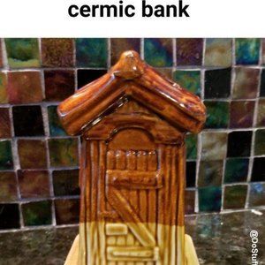 Whimsical ceramic bank. Hillbilly outhouse